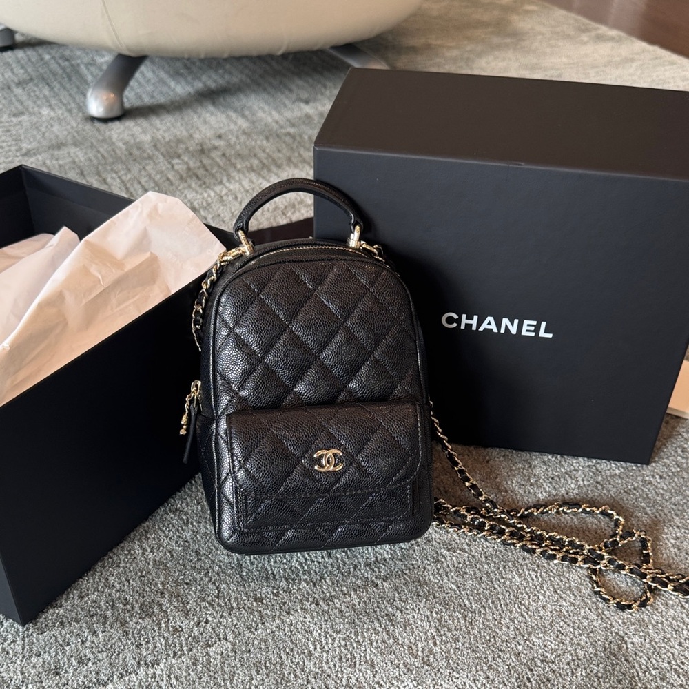 CHANEL Black Quilted Caviar Leather Mini Bag
